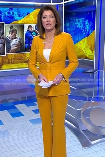 Norah’s yellow belted suit on CBS Evening News