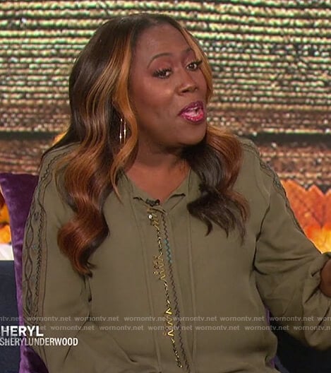Sheryl’s green embroidered trim blouse on The Talk