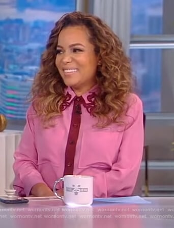 Sunny’s pink contrast trim blouse on The View