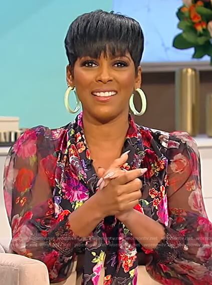 Tamron’s black floral tie neck blouse on Tamron Hall Show