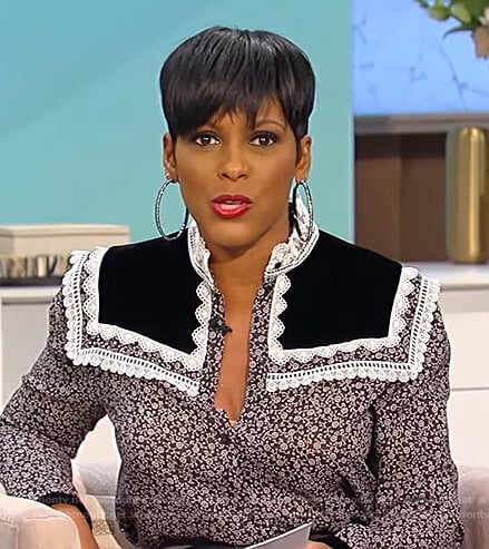 Tamron’s black floral lace trim blouse on Tamron Hall Show