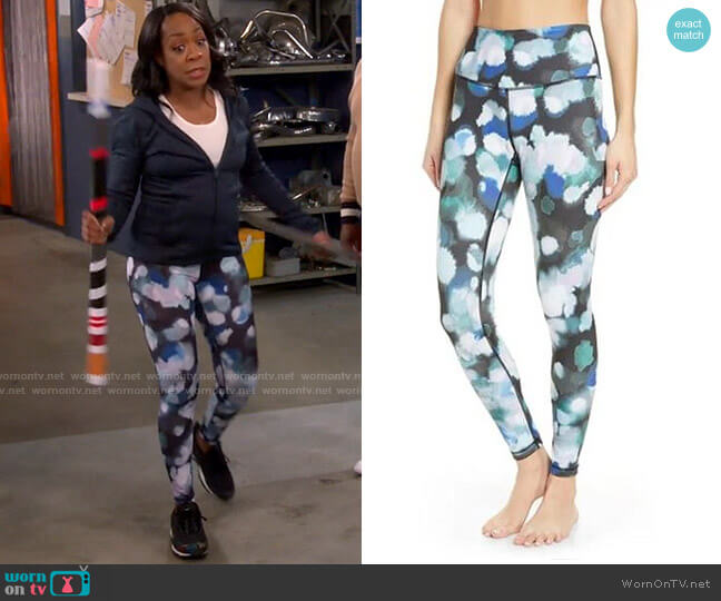Zella Live In High Waist Ankle Performance Leggings in Black Teal Color Bursts worn by Tina Butler (Tichina Arnold) on The Neighborhood