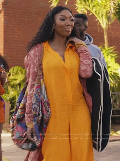 Naomi’s orange linen jumpsuit on Queens