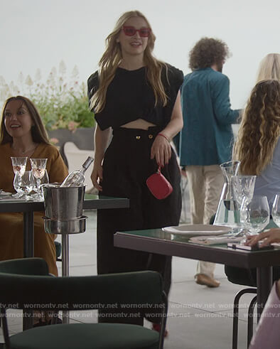 Camille’s black pants and sunglasses on Emily in Paris