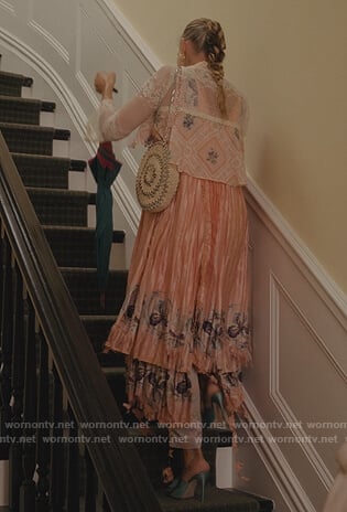 Carrie’s woven shoulder bag with metal detail on And Just Like That