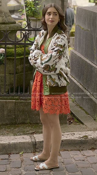 Emily’s orange lace dress and horse print bomber jacket on Emily in Paris