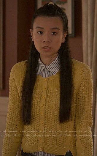 Evangeline’s yellow knit cardigan on The Sex Lives of College Girls