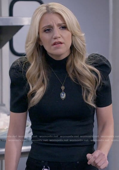 Gina’s black puff sleeve top on B Positive