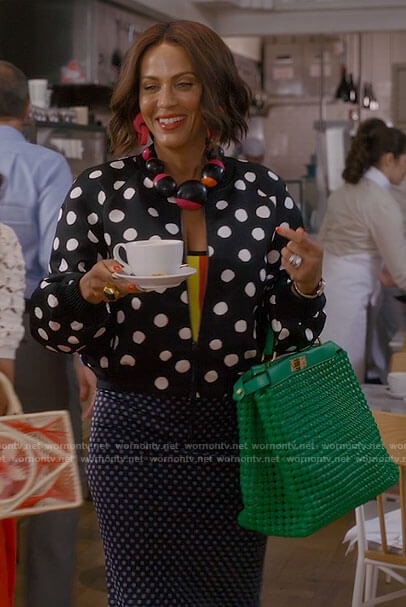 Lisa’s polka dot bomber jacket and green bag on And Just Like That