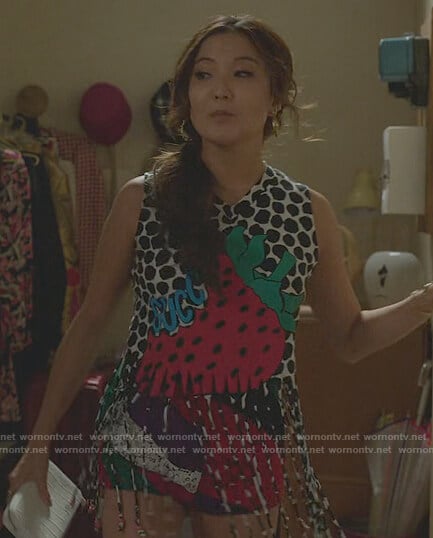 Mindy’s strawberry print fringe tank on Emily in Paris