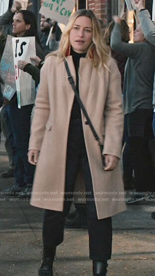 Summer’s camel coat with red collar on Yellowstone