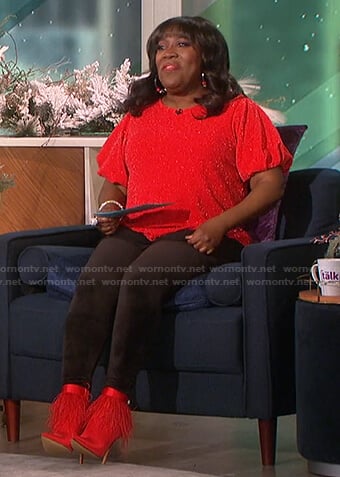 Sheryl’s red metallic puff sleeve top and feather boots on The Talk