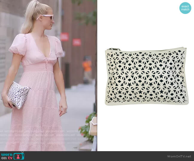 Givenchy Pandora Star Laser Cut Medium Pouch White Leather Clutch worn by Paris Hilton on Paris in Love