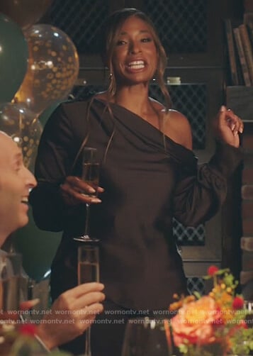 Mika’s black one off shoulder top on Kenan