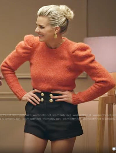 Amy’s orange puff sleeve sweater and button detail shorts on Pivoting