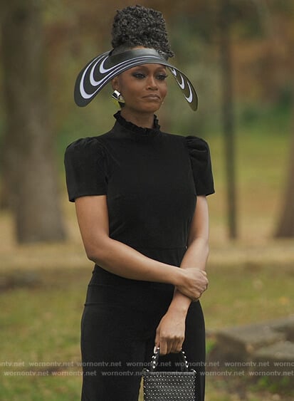 Angela’s black velvet jumpsuit on Our Kind of People