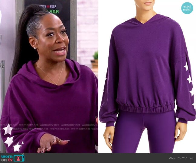 Aqua Athletic Star Sleeve Hoodie in Boysenberry worn by Tina Butler (Tichina Arnold) on The Neighborhood