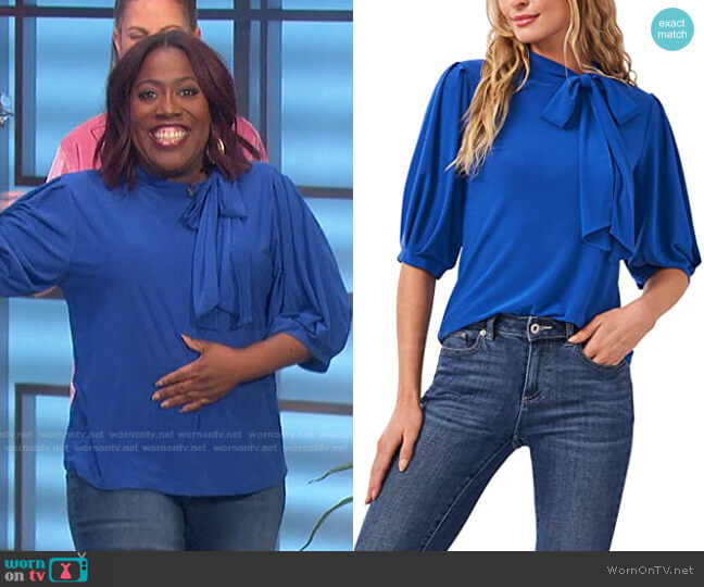 Cece Puff Sleeve Crepe Knit Top with Bow worn by Sheryl Underwood on The Talk