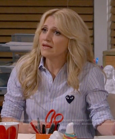Gina’s blue striped shirt with heart on B Positive