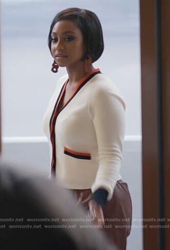 Jojo’s white contrast trim cardigan on Home Economics