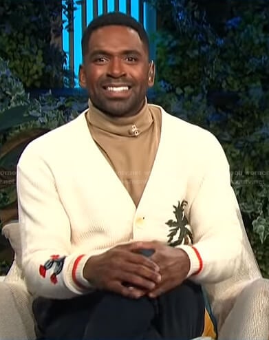 Justin’s white embroidered cardigan on E! News Daily Pop