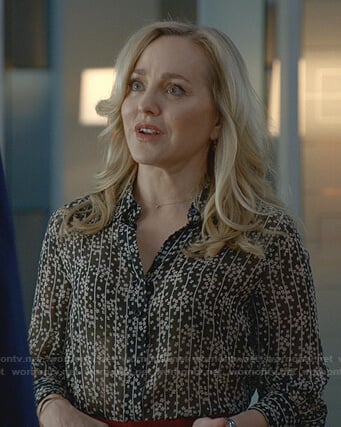 Marissa’s black floral blouse and red pants on Bull