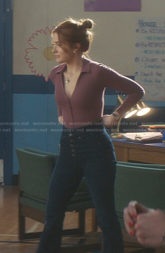 Nancy’s pink v-neck polo top and jeans on Nancy Drew