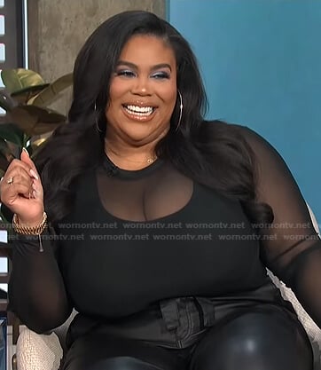 Nina’s black long sleeve mesh top on E! News Daily Pop