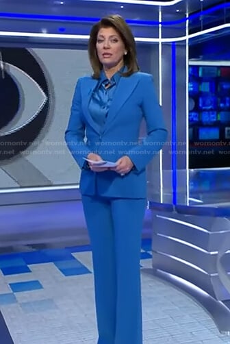 Norah’s blue satin shirt and peak lapel blazer on CBS Evening News