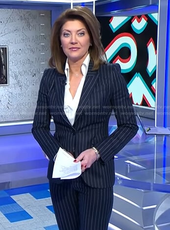 Norah’s navy pinstripe suit on CBS Evening News