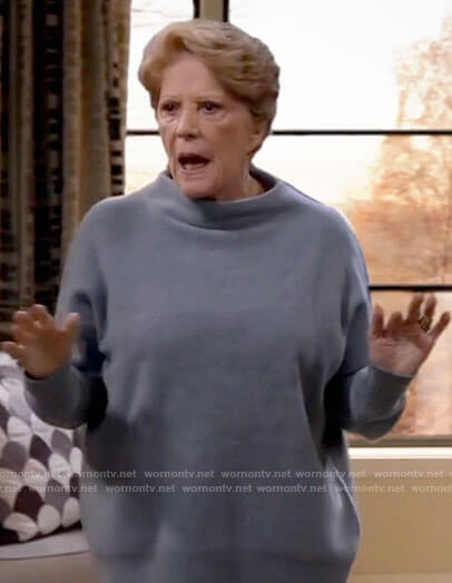 Norma’s blue mock neck sweater on B Positive