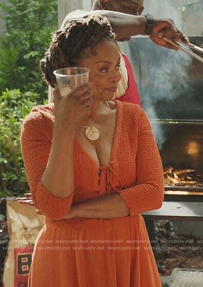 Patricia’s orange smocked dress on Our Kind of People