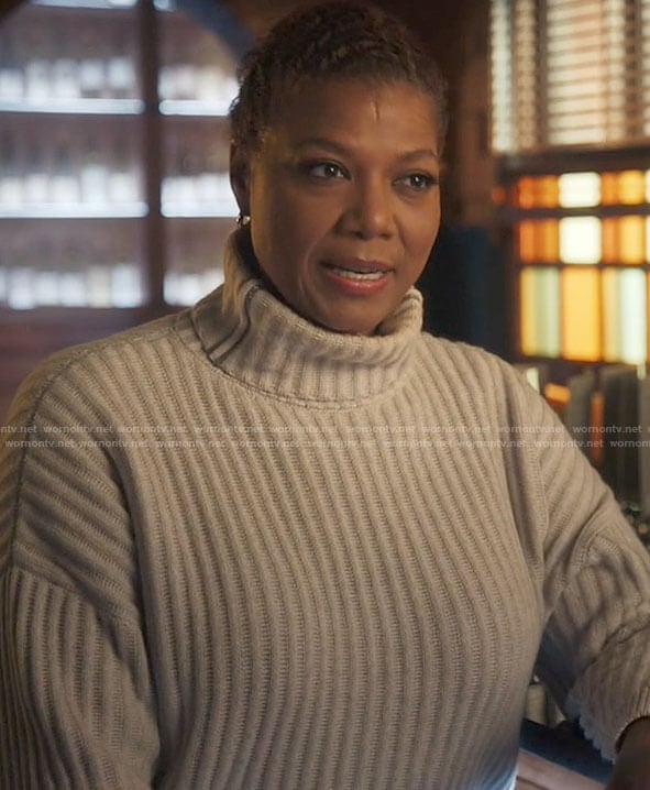 Robyn’s white turtleneck with metallic stripes on The Equalizer