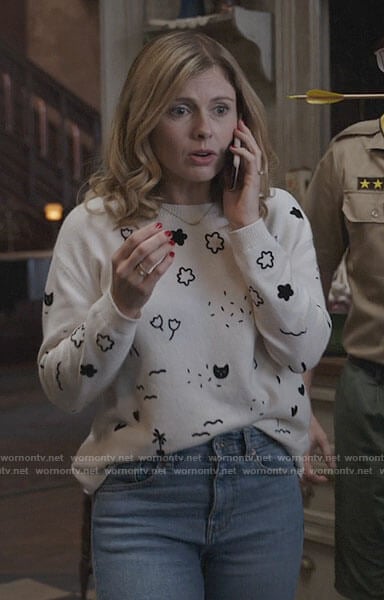Sam’s white sweater with flowers and cats on Ghosts