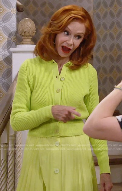 Sheila’s lime green cardigan and pleated skirt on Call Me Kat