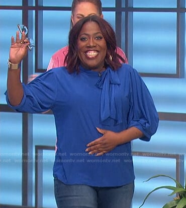 Sheryl’s blue tie neck top on The Talk