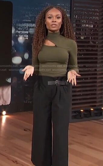 Zuri’s green cutout top and black belted pants on Access Hollywood