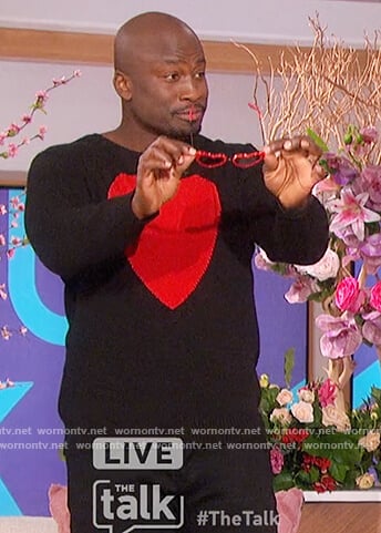 Akbar’s black heart print sweater on The Talk