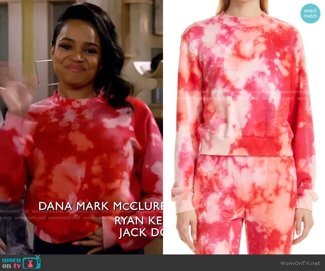 Cotton Citizen Milan Tie Dye Crop Sweatshirt in Poppy Blast worn by Randi (Kyla Pratt) on Call Me Kat