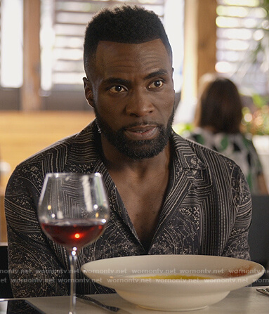 Eric’s black printed shirt on Queens