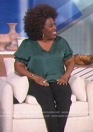 Sheryl’s green smocked v-neck top on The Talk