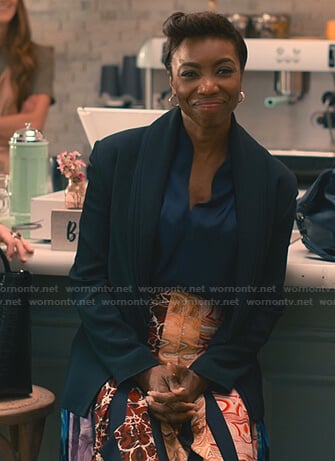 Helen’s layered lapel jacket and mixed print pleated skirt on Sweet Magnolias