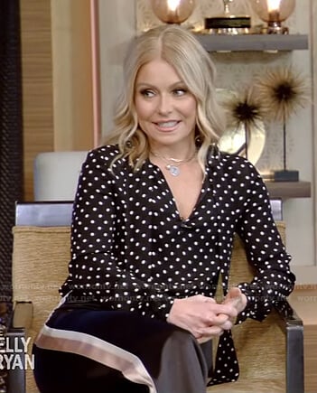 Kelly’s black polka dot blouse and side stripe pants on Live with Kelly and Ryan