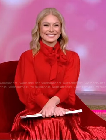 Kelly’s red tie neck blouse and pleated skirt on Live with Kelly and Ryan