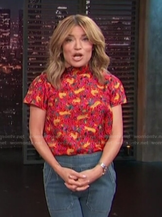 Kit’s red animal print short sleeve top on Access Hollywood