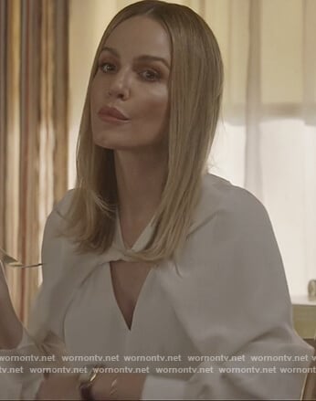 Laura’s white twist neck blouse on All American