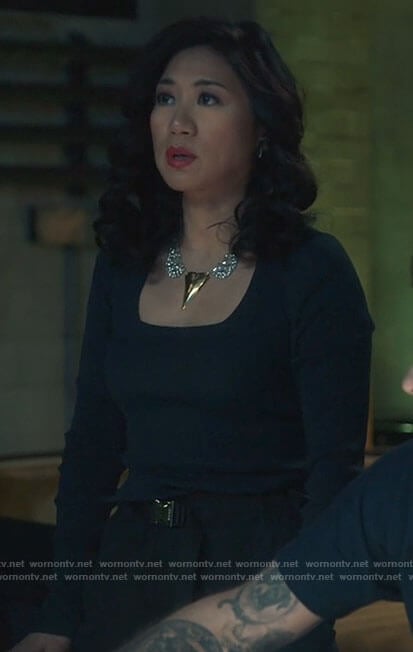 Mel’s navy square neck top and buckled pants on The Equalizer