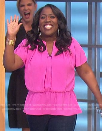 Sheryl’s pink v-neck top on The Talk