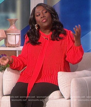 Sheryl’s red pleated tie neck blouse on The Talk