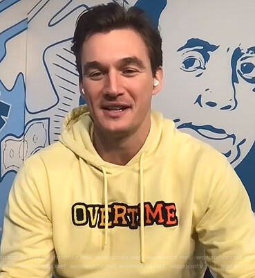 Tyler Cameron’s yellow Overtime hoodie on E! News Daily Pop